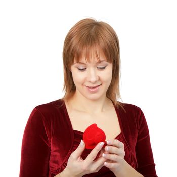 young girl with a box for rings on a light background
