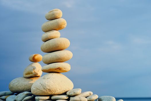 White Stack of zen stones on a sky background
