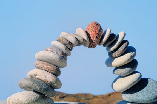 Red stone in the center of pebble bending