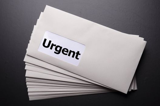 urgent delivery concept with envelope letter or mail and word