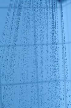 water drops falling from a shower indoors