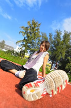 sport girl sitting in sport field