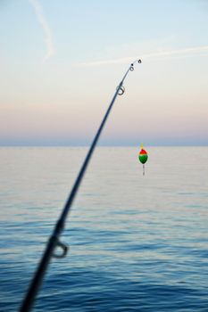 Fishing pole waiting to be cast, with line and sinker