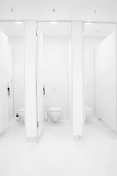 a clean new public toilet room empty