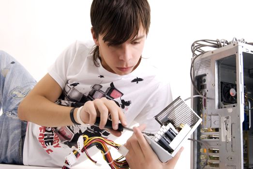  young man repairing his computer