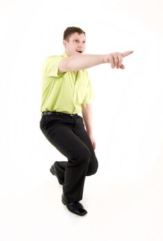 Handsome young man pointing away over white background 