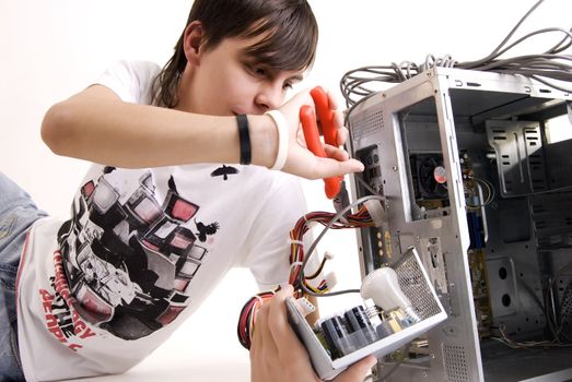  young man repairing his computer