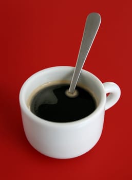 cup of coffee on red background