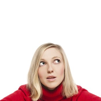 Close-up portrait of a beautiful young woman. Looking up into the corner. Lots of copyspace and room for text on this isolate. 