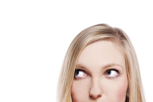 Close-up portrait of a beautiful young woman. Looking up into the corner. Lots of copyspace and room for text on this isolate. 