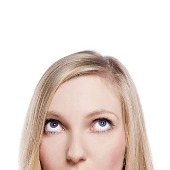 Close-up portrait of a beautiful young woman. Looking up. Lots of copyspace and room for text on this isolate. 