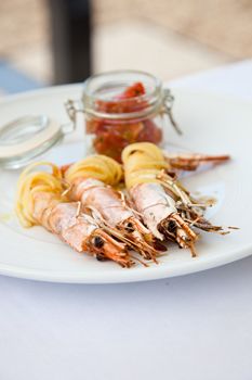 Plate of delicious prawns wrapped in pasta on a plate