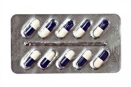 capsules packed in blister isolated on white 
