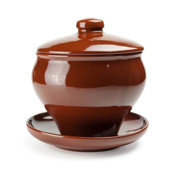 brown ceramic pot over the white background