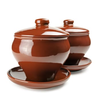 brown ceramic pot over the white background