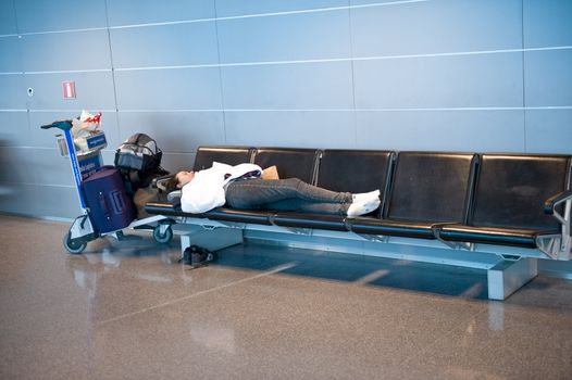 The sleeping girl at the airport of Helsinki Vantaa