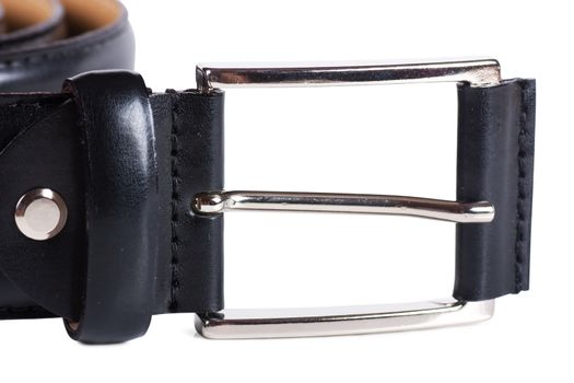 Men's black leather belt with metallic buckle over white