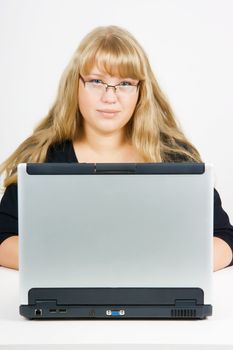 blonde with long beautiful hair with a laptop