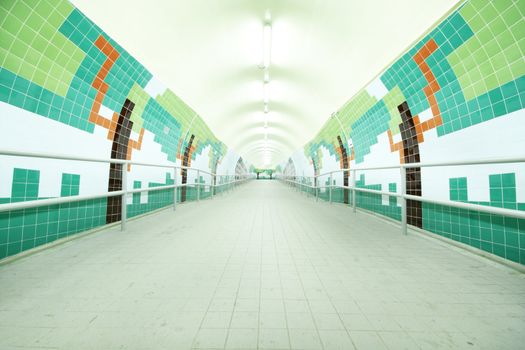 long tunnel with lamps and nobody walking 