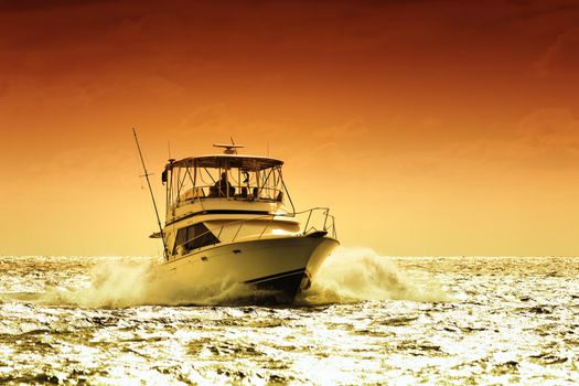 boat on a caribbean sea with sunset