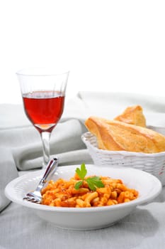 Macaroni with a tomato beef sauce served with crusty bread.