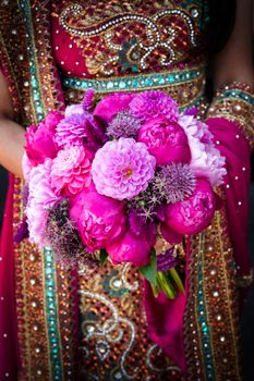 Image of an Indian brides hands holding bouquet