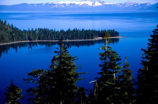 Lake Tahoe is a large freshwater lake in the Sierra Nevada mountains of the United States. It is located along the border between California and Nevada, west of Carson City, Nevada. The lake is known for the clarity of its water and the panorama of surrounding mountains on all sides.