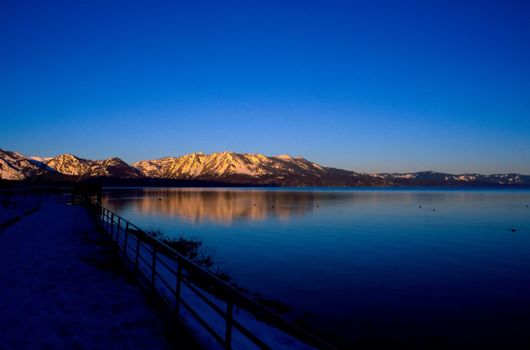 Lake Tahoe is a large freshwater lake in the Sierra Nevada mountains of the United States. It is located along the border between California and Nevada, west of Carson City, Nevada. The lake is known for the clarity of its water and the panorama of surrounding mountains on all sides.