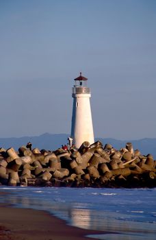 Santa Cruz Harbor - Located at the northern end of the Monterey Bay, the Santa Cruz Harbor is a haven for fishing craft and vessels. A harbor light, located at the west jetty, has marked its entrance for 40 years. The original light was a box light structure which served from 1964 � 1996. It was replaced by a cylinder nicknamed �the water heater� which was used from 1996 � 1999. From 1999 until May 2002, a simple pipe structure held the light which marked the way.