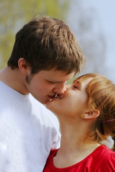 young man and woman kissing