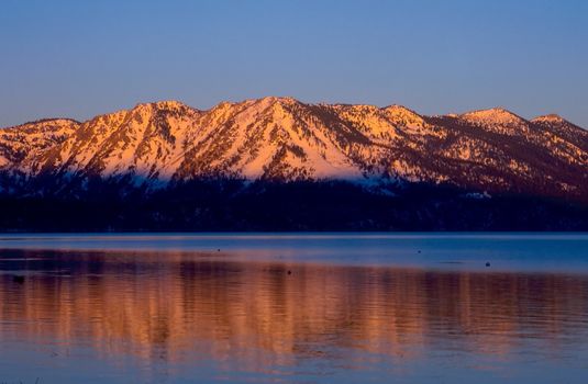 Lake Tahoe is a large freshwater lake in the Sierra Nevada mountains of the United States. It is located along the border between California and Nevada, west of Carson City, Nevada. The lake is known for the clarity of its water and the panorama of surrounding mountains on all sides.