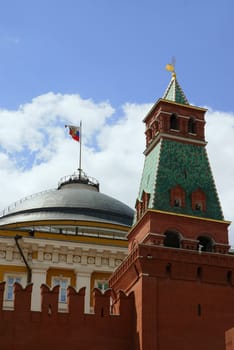 Russian flag over government building behind Kremlin wall