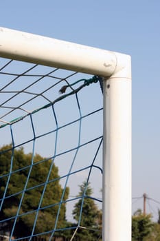 detail from soccer goalpost and blue sky background sports concepts