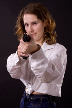 woman on black handing gun
