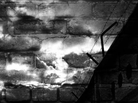 a barbed wire against background of a brick wall and cloudy sky