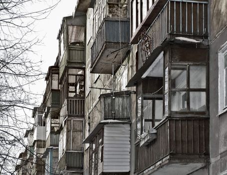 part of a wall of a building with a number of balconies