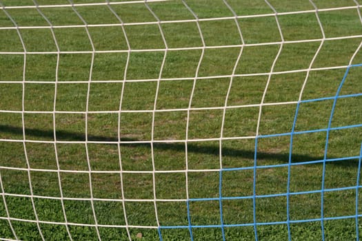 goalpost net detail with green grass  background sports concepts