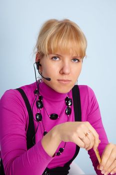 The beautiful young girl - the worker of a call center