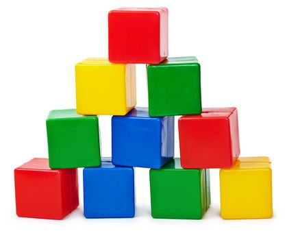 Curve pyramid from color cubes constructed by the child isolated on white background