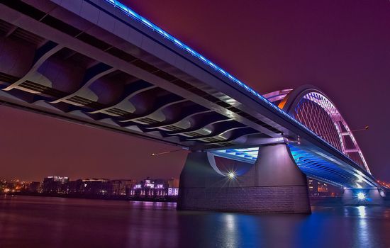 Bratislava Apollo Bridge night view with water reflection