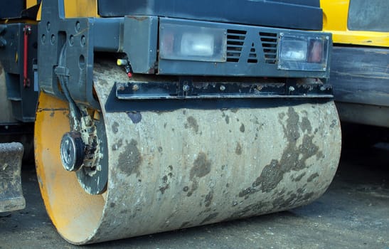 road roller parked in a factory