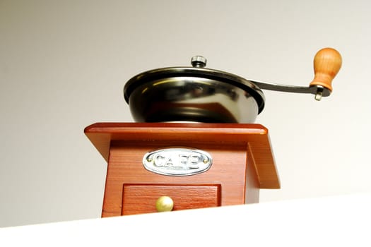 Interesting side foto of old fashioned coffee grinder