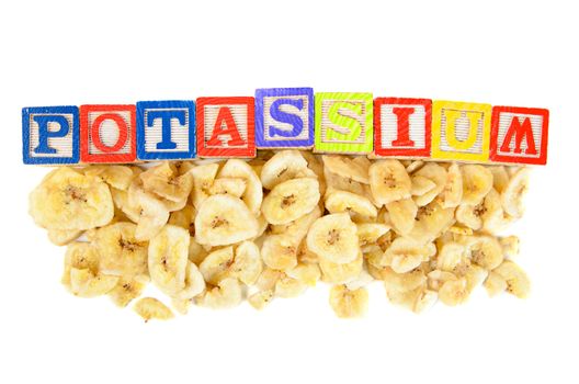 The word potassium spelled out over some banana chips.