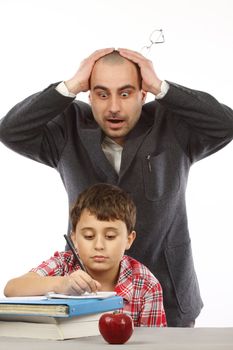 Schoolboy and shocked  teacher in classroom 