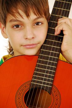 caucasian boy portrait with orange wooden guitar