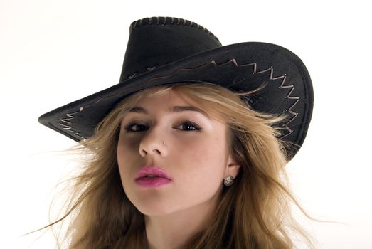 young sexy cowgirl posing indoors