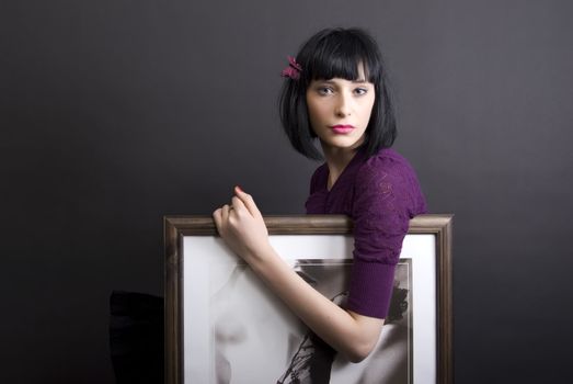 young girl with painting over black