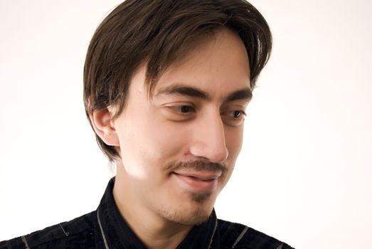 Portrait of a young dark-haired man over white