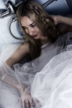 young bride posing in bathroom