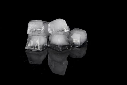 a lot of  ice-cubs on a black background